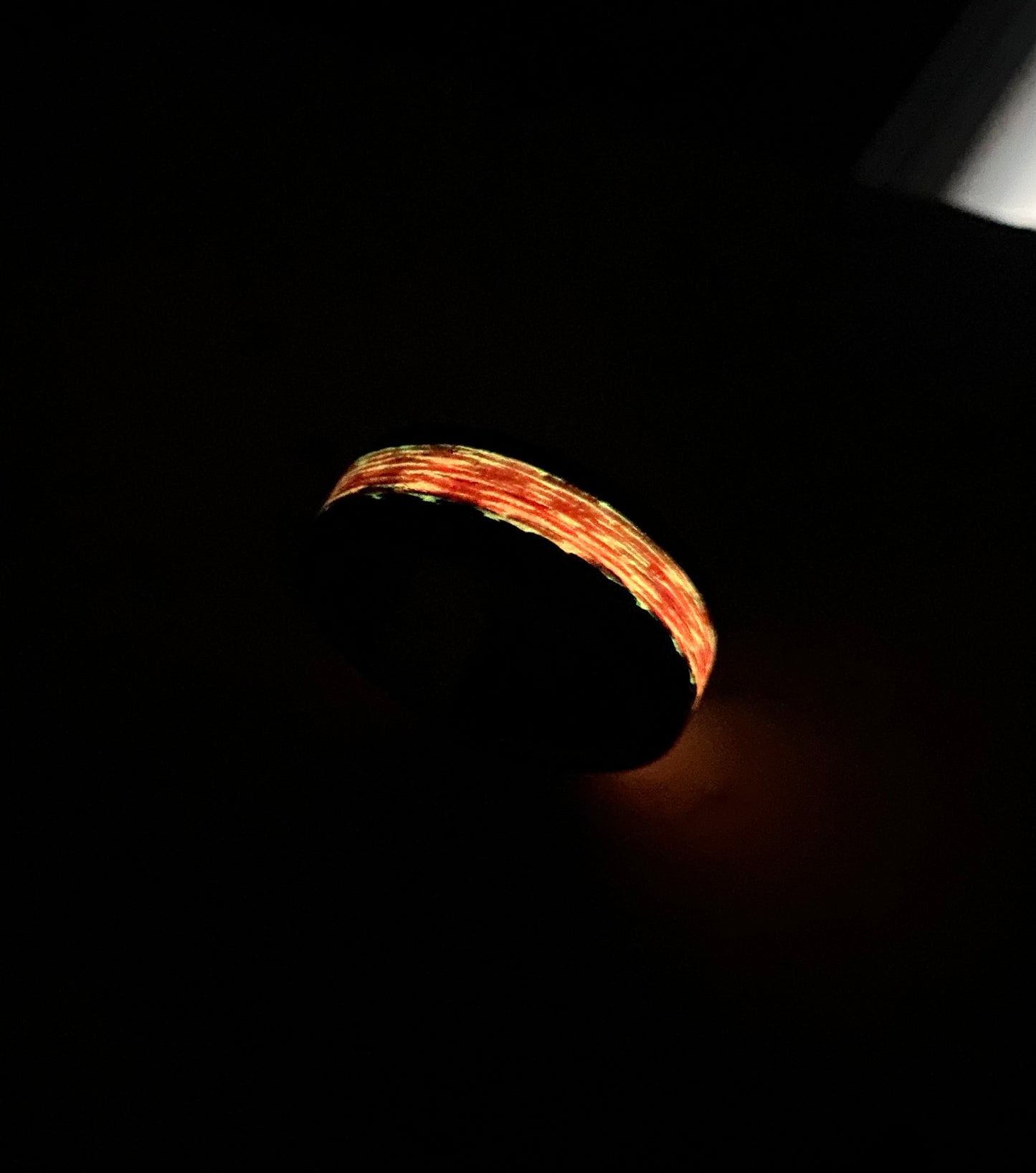 Phosphorescent Ring in Carbon Fiber and Titanium