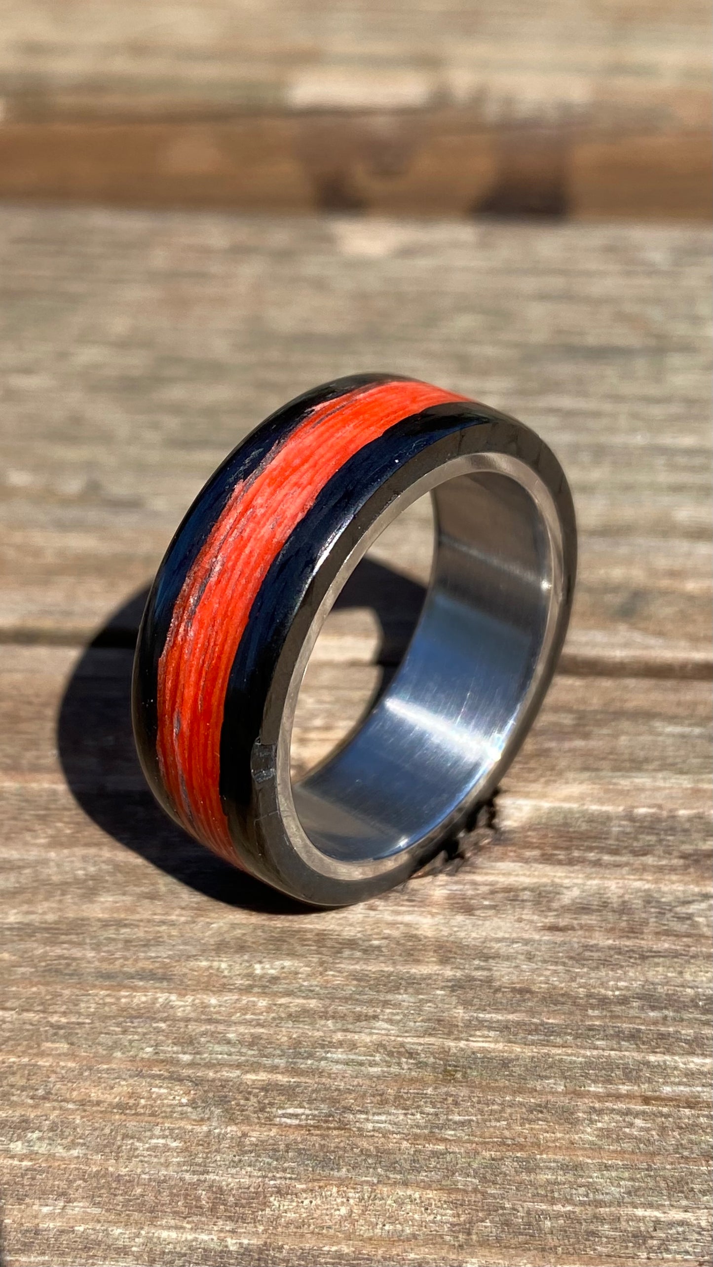Phosphorescent Ring in Carbon Fiber and Titanium