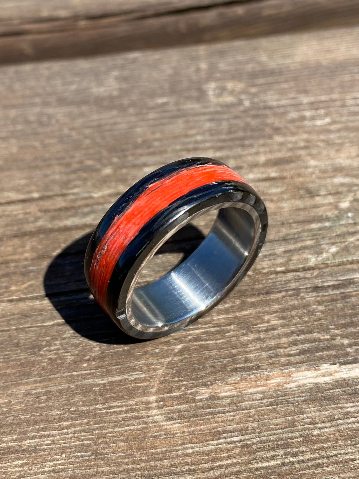 Phosphorescent Ring in Carbon Fiber and Titanium