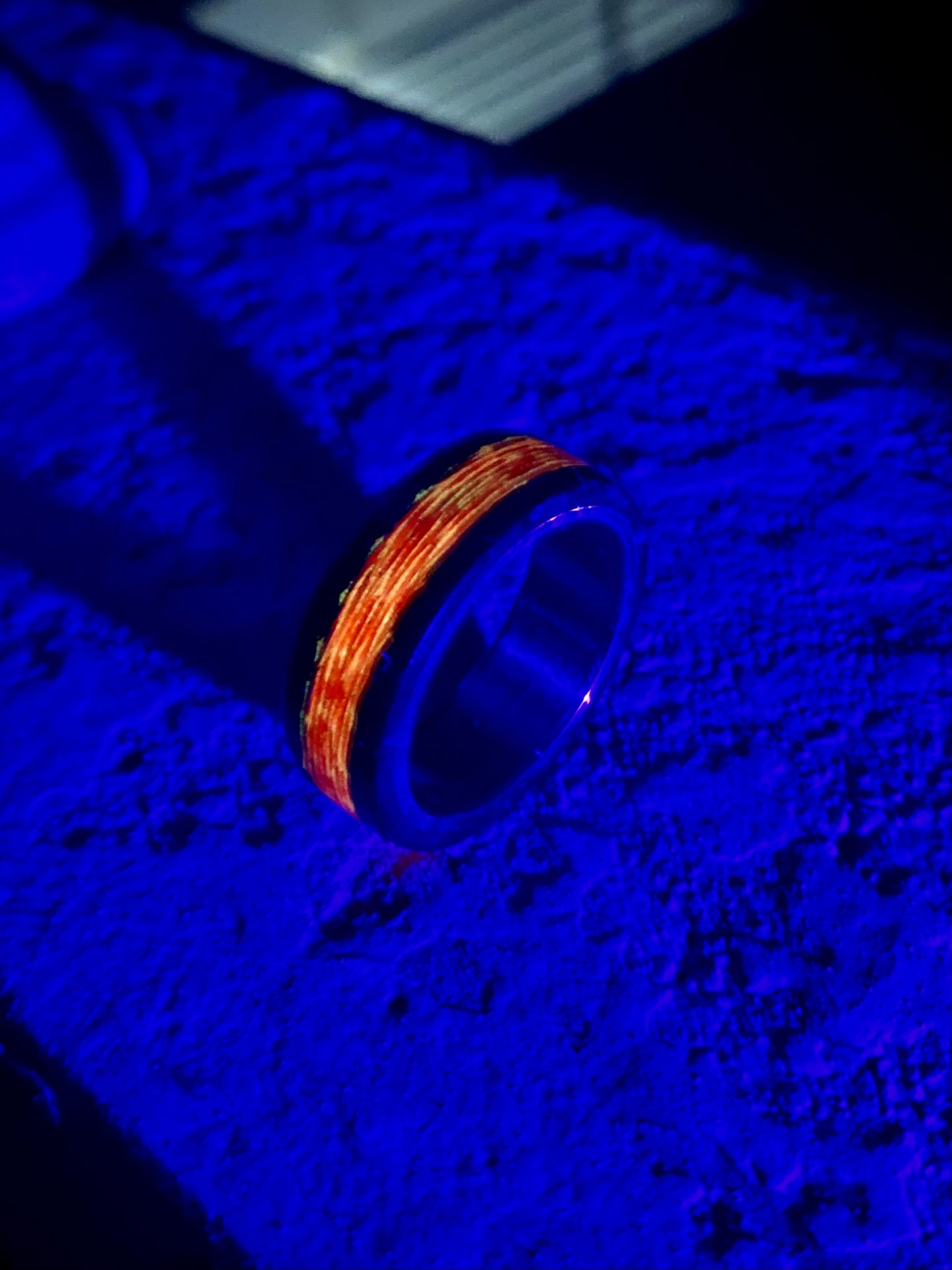 Phosphorescent Ring in Carbon Fiber and Titanium