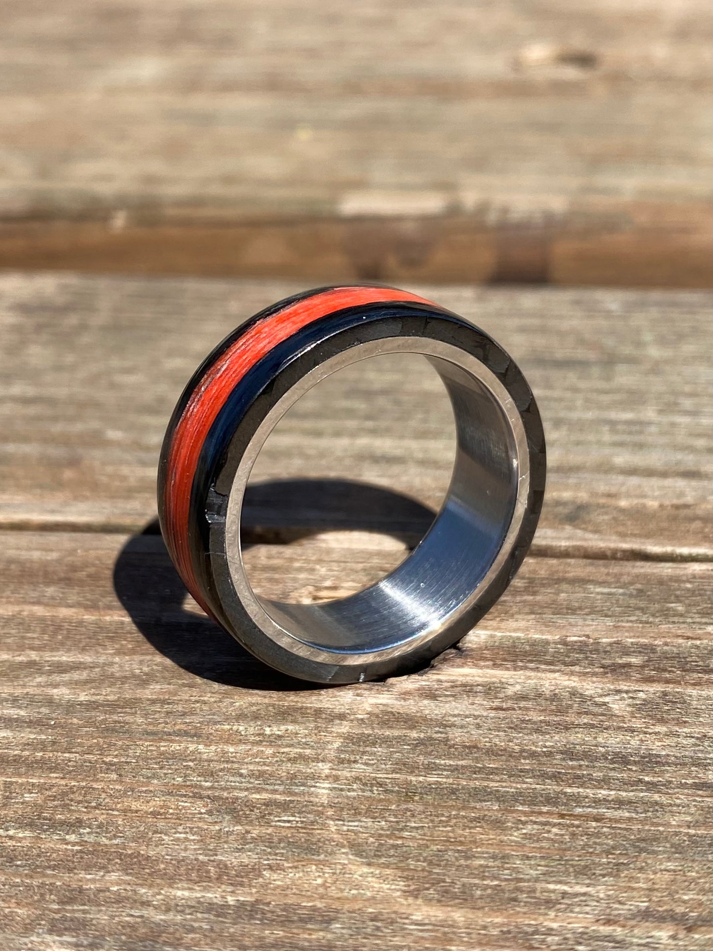 Phosphorescent Ring in Carbon Fiber and Titanium