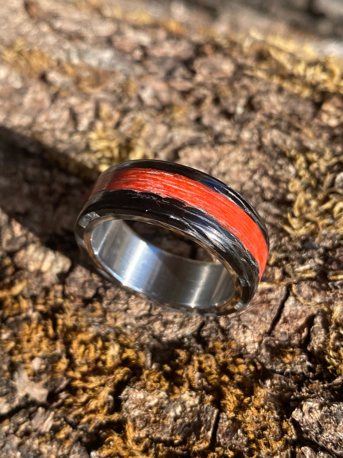 Phosphorescent Ring in Carbon Fiber and Titanium