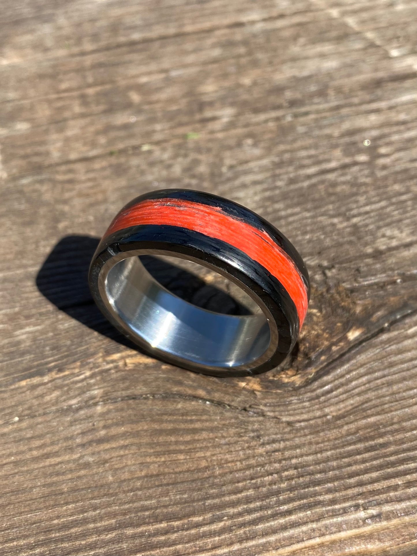 Phosphorescent Ring in Carbon Fiber and Titanium