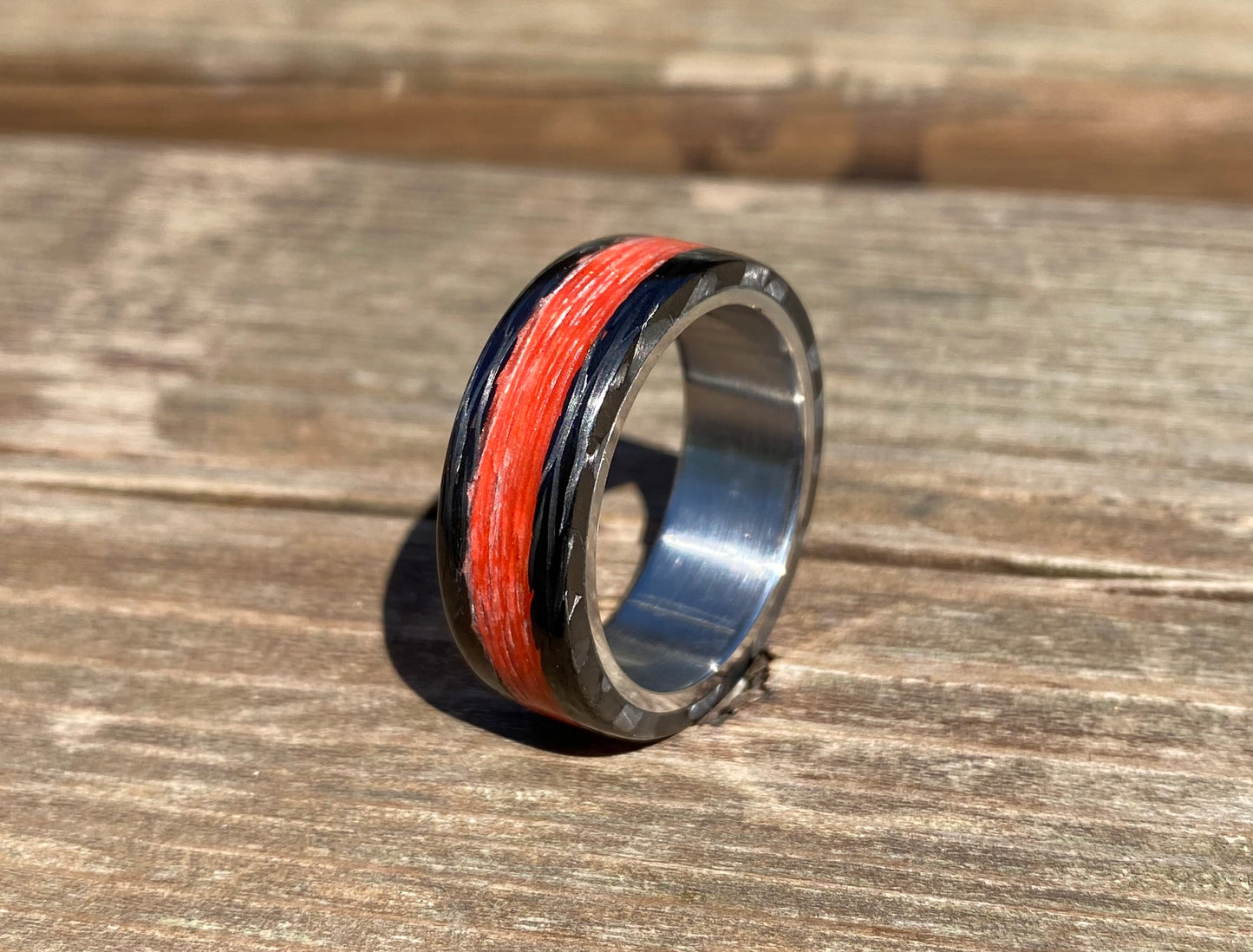 Phosphorescent Ring in Carbon Fiber and Titanium