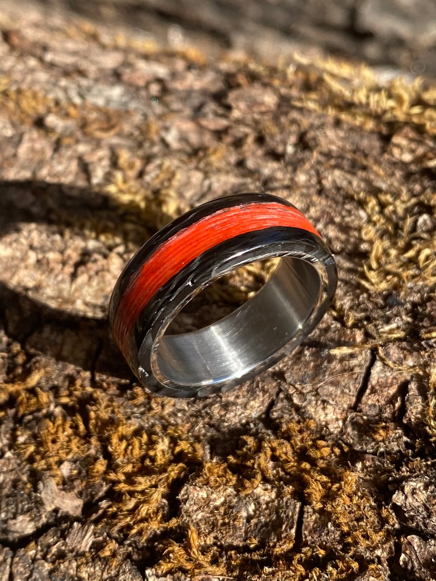 Phosphorescent Ring in Carbon Fiber and Titanium